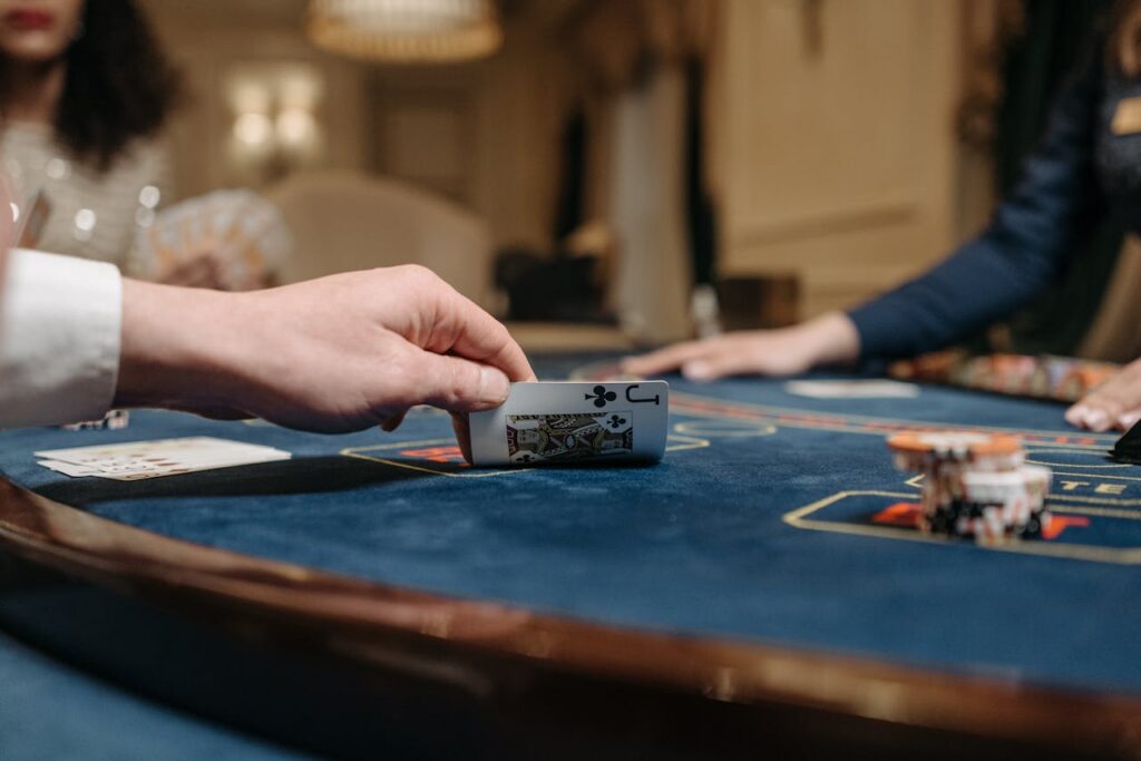 A detailed view of a poker game in action with cards and chips on the table.